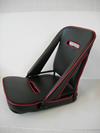 ZAGATO-style folding seat finished in vinyl with open sides and oval opening both on seat back and cushion. Available in various colours and also hide. Finished with coloured piping around sides.